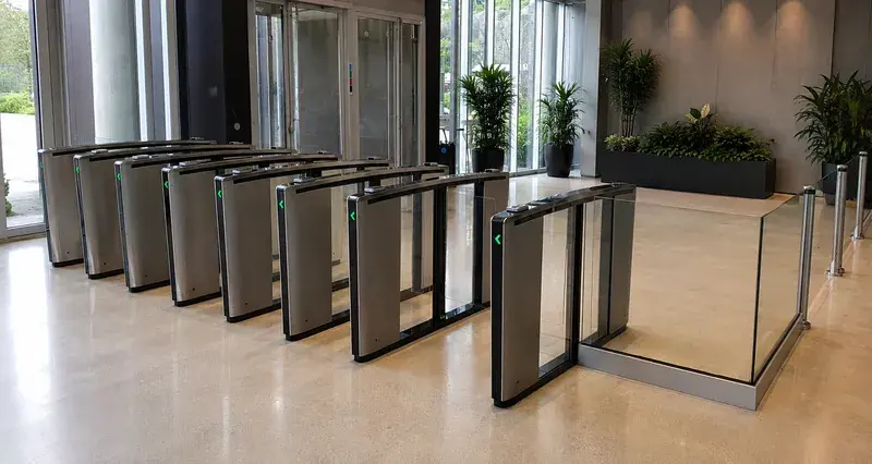 Boon Edam optical speed gate lanes in a corporate lobby